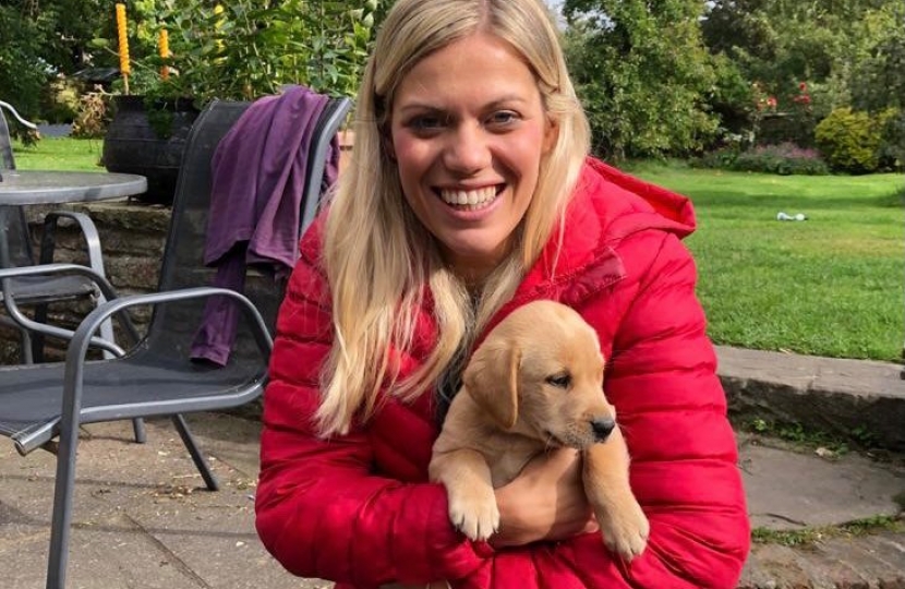 Miriam with a puppy named Red