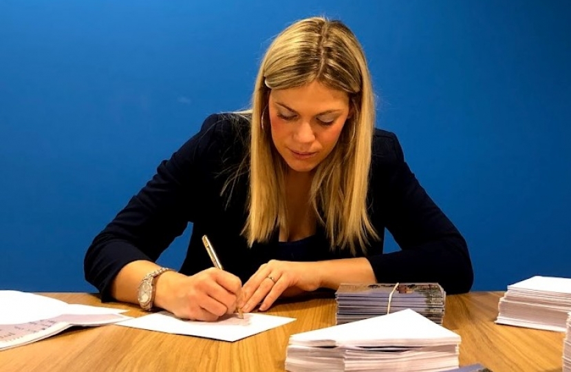 Miriam Cates MP signing letters in Penistone and Stocksbridge