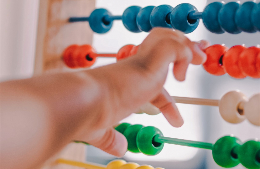 An abacus and baby indicating the importance of family tax policy