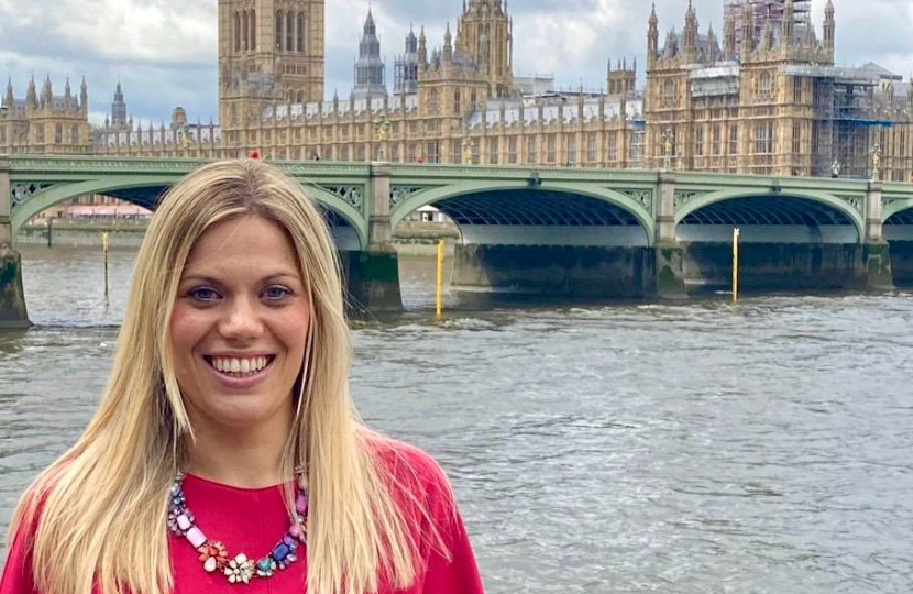 Miriam Cates MP stands outside the Houses of Parliament