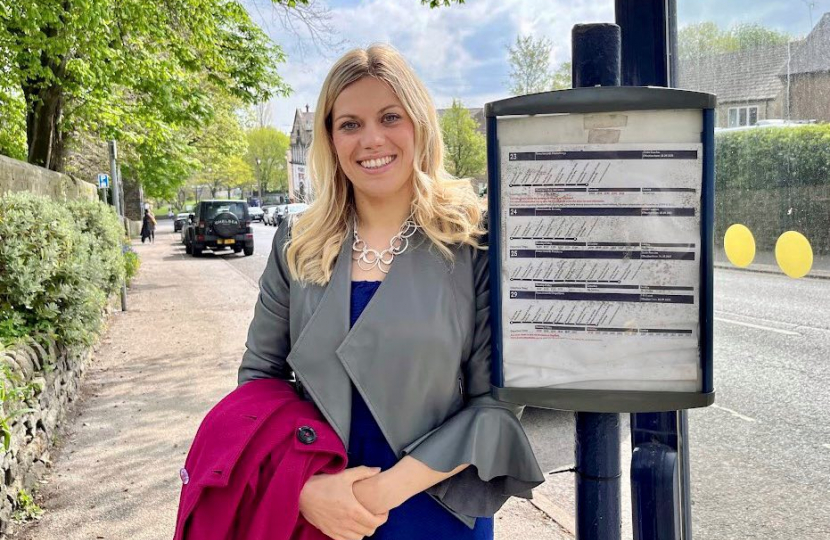 Miriam waiting at a bus stop - announcing £130 million in funding