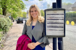 Miriam waiting at a bus stop - announcing £130 million in funding