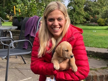 Miriam with a puppy named Red