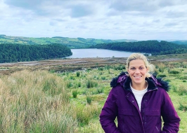 Miriam standing above the river to highlight flood risk