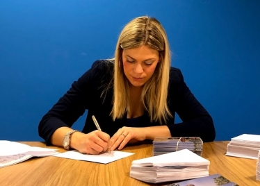 Miriam Cates MP signing letters in Penistone and Stocksbridge