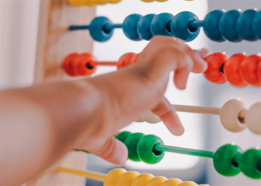 An abacus and baby indicating the importance of family tax policy