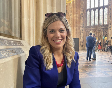 Miriam Cates MP sitting in Central Lobby Houses of Parliament