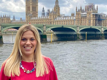 Miriam Cates MP stands outside the Houses of Parliament