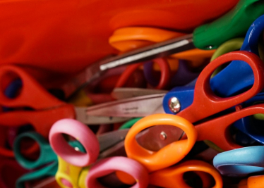 Box of scissors depicting child protection