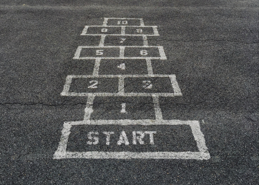 Hop Scotch depicting empty schools during COVID